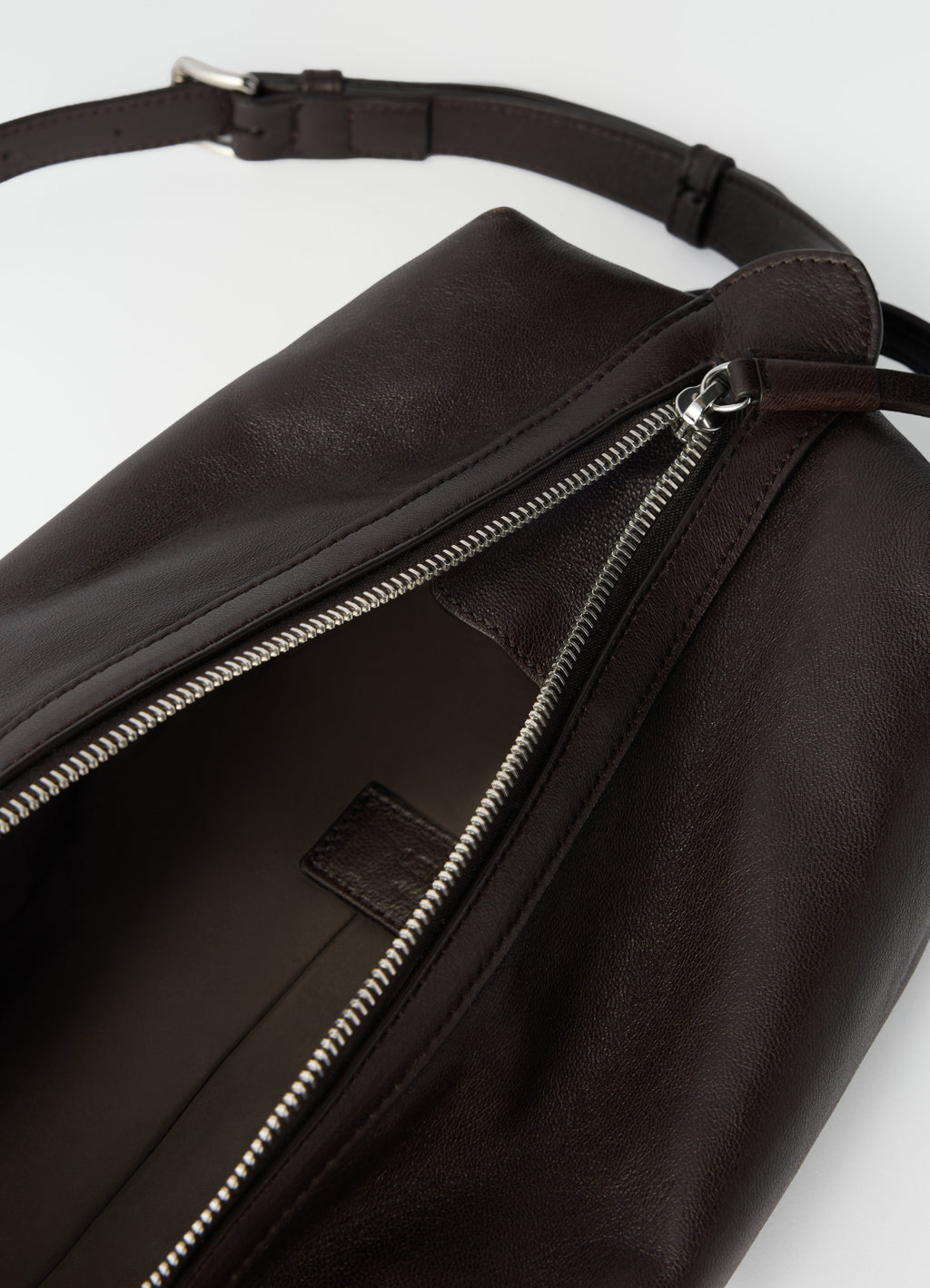 THE CARE SLINGBAG IN SOFT NAPPA LAMBSKIN LEATHER