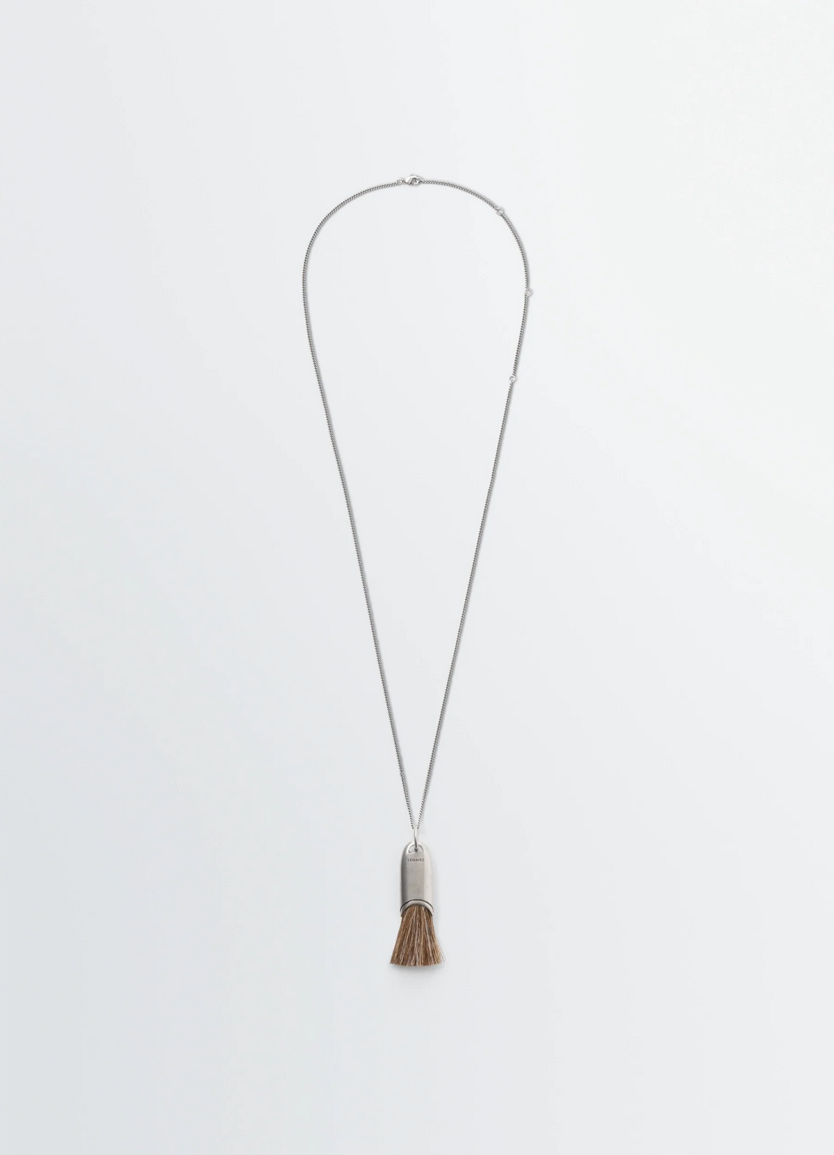 PERSONAL BRUSH NECKLACE IN BRASS