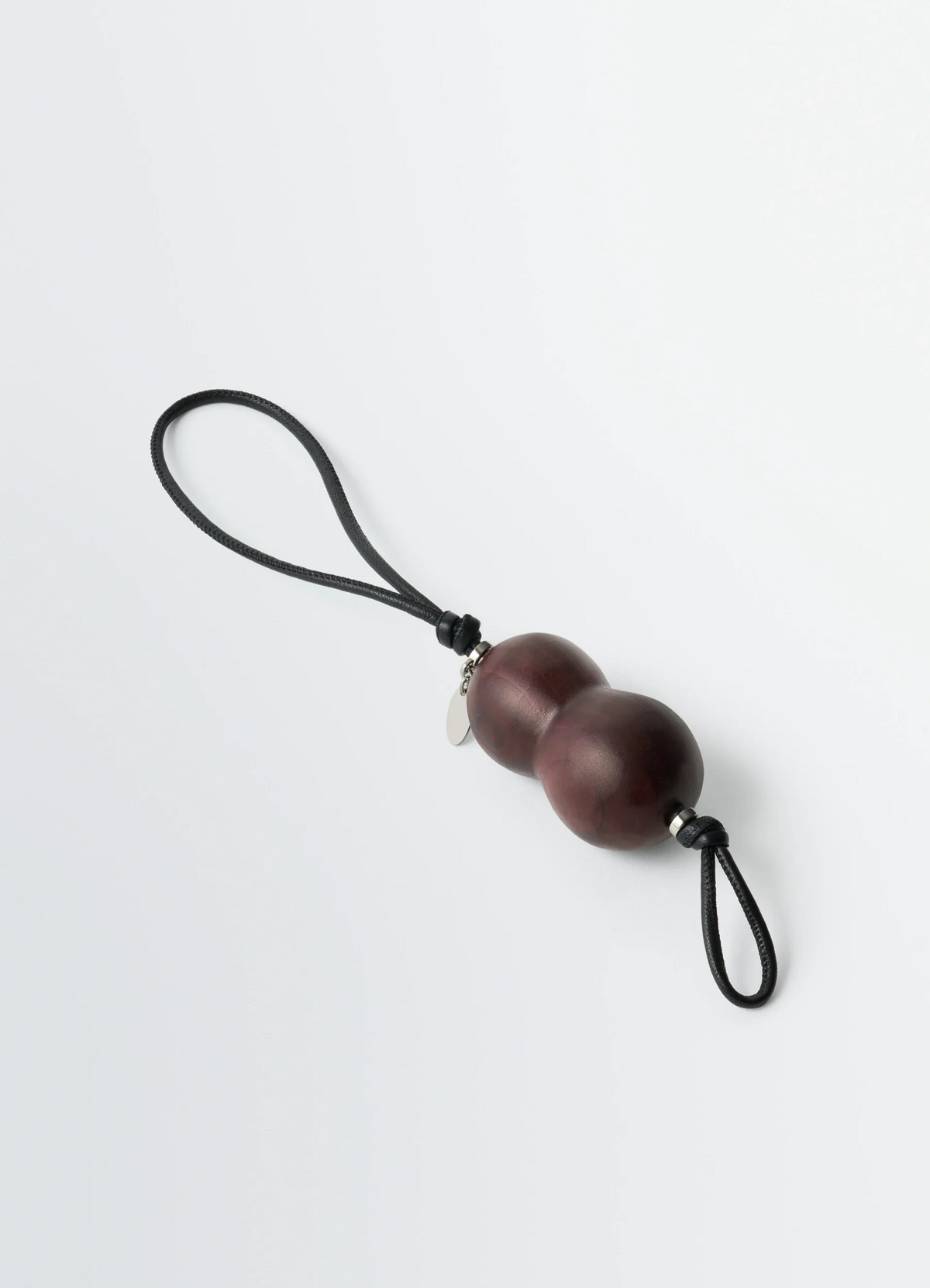 PEANUT HEEL CHARM IN STACKED LEATHER